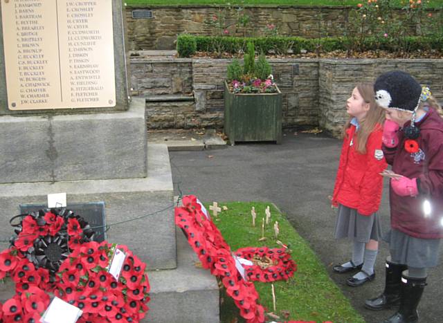 Children from St John with St Michael CE Primary School in Shawforth at Whitworth Cenotaph
