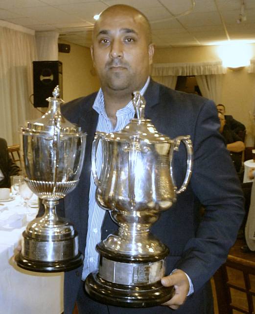 Norden's Hashum Malik shows off the Premiership Trophy and Wood Cup