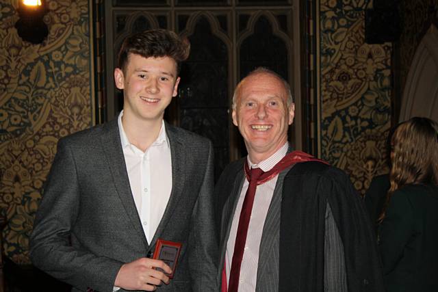 Joe Whatmough is handed the Double Science subject prize from Dr Wright