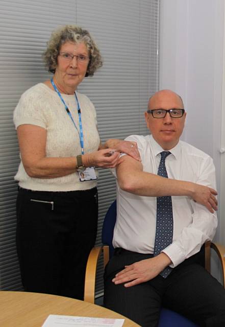 Chief Executive Michael McCourt with immuniser Janet Wray