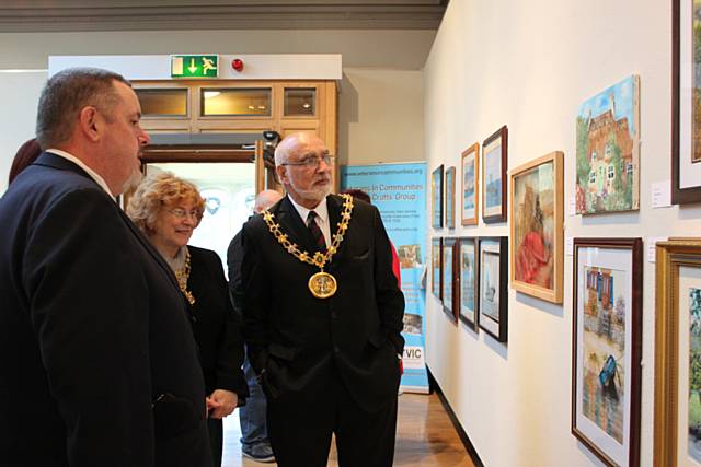 Veteran Darren Horsnell shows the Mayor and Mayoress around the exhibition at Touchstones
