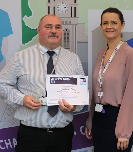 Employee volunteer of the year, Graham Dures, receives his award from RBH Head of Community Investment, Sarah Robinson