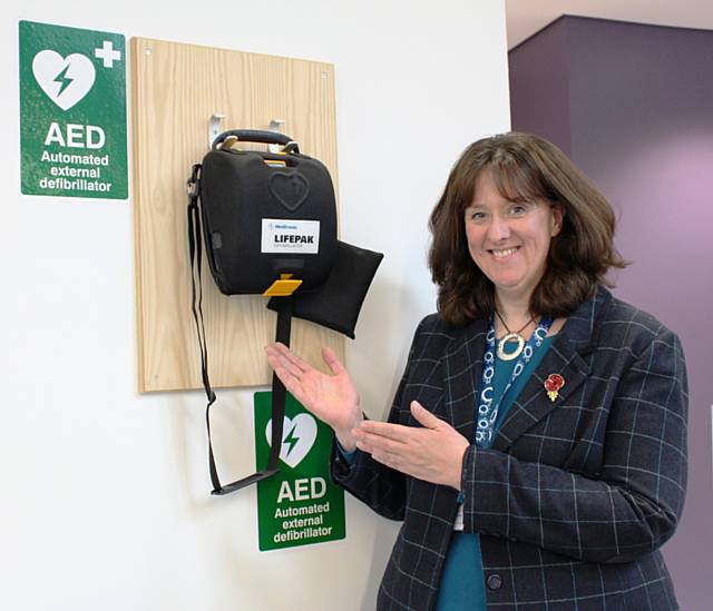 Andrea Fallon, Director of Public Health with a defibrillator at Number 1 Riverside in Rochdale