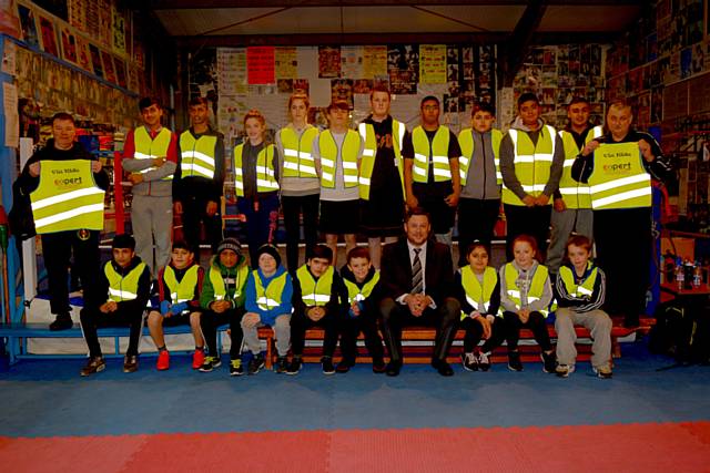 Dan Haydock of Expert Industrial with Hamer Boxing members wearing hi visibility waistcoats 