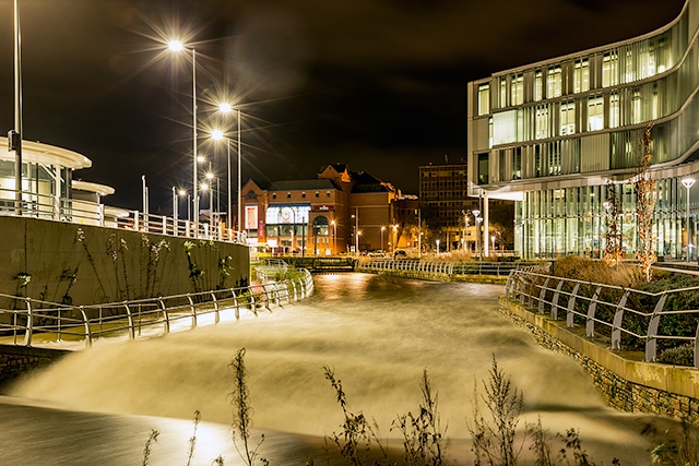 River Roch swollen by heavy rain in Rochdale town centre