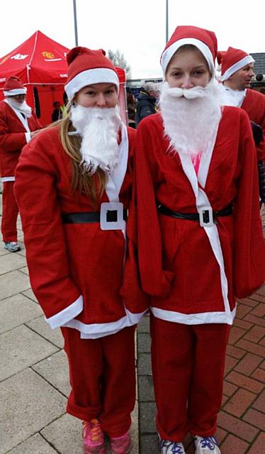 Elle Gregson-Howarth and Alex Lord compete in Santa dash