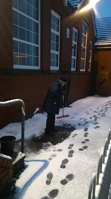 Mr Porter clearing snow at Moorhouse Primary School in Milnrow 
