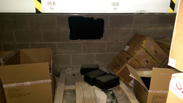 Bricks removed from an internal wall in order to steal approximately 2000 boxes of trainers 