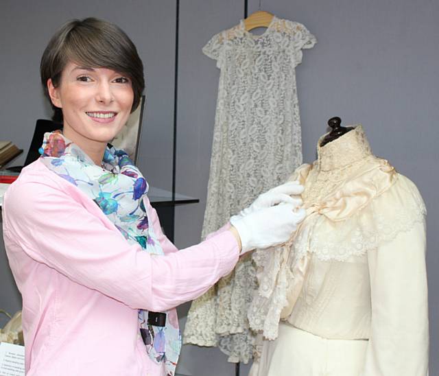 Natalie Rhodes (Art and Heritage Assistant-Museum) with the wedding dress detailed above 