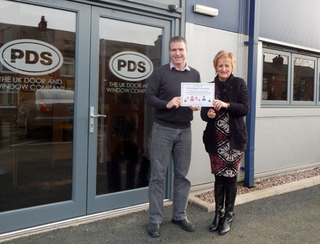 Elaine Mcconnell, Regular Giving Coordinator at Springhill Hospice presenting Tim Fairley, Managing Director at PDS with their Business Buddies Certificate