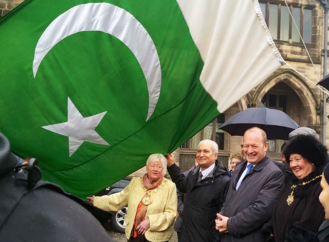 Mayor Carol Wardle, Gulam Shahzad OBE, Simon Danczuk MP  and Mayoress Beverley Place at the raising of the Pakistani flag (upside down!) at Rochdale Town Hall