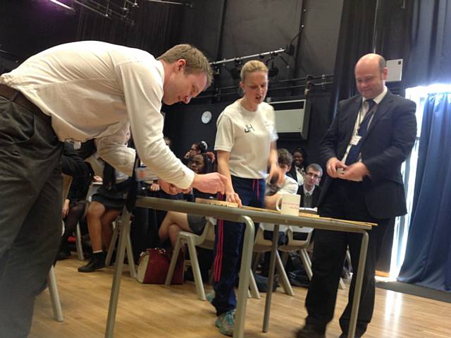 Miss Holt challenged Mr McCabe and Mr Shields to balance 10 nails on top of one