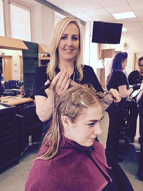 Sara Waddington practicing her hairdressing skills