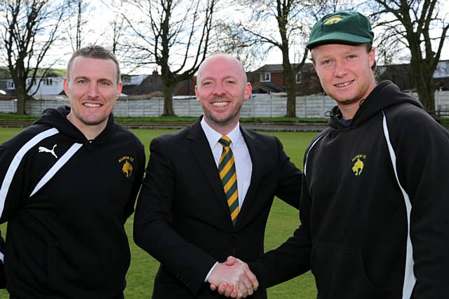 Brandon Diplock (right) with Milnrow Cricket Club Chairman, Colin Williamson, and First XI captain, Max Power