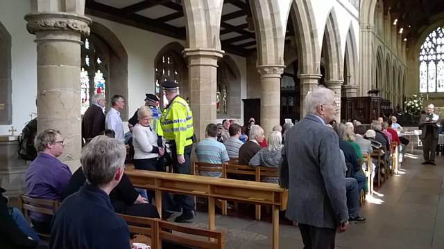 Police escorting National Front members out of the Rochdale constituency General Election hustings