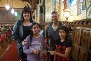 Hamer Primary School Assistant Head, Mrs Hoyle; Sehar; Hamer Primary School Head Mr Moore and Komal were awarded a trophy for their public speaking in the Rochdale Music and Arts Festival