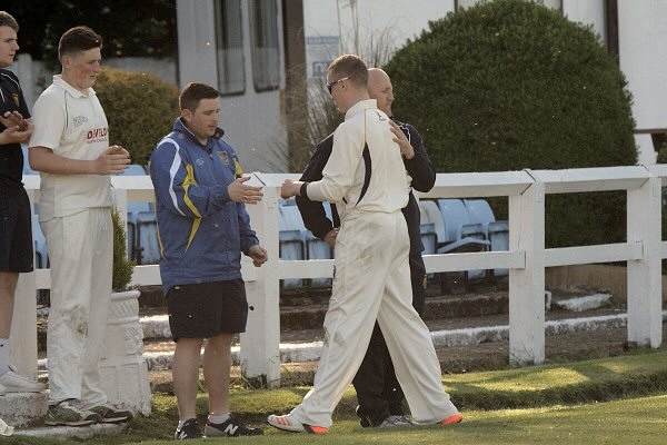 Simon Dawson is congratulated by Clinton Perren after his 6-20 haul