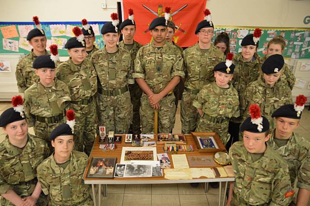 Rochdale Army Cadets with photos and medals from their research into soldiers military service