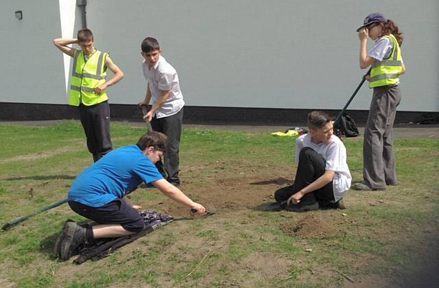 St Cuthbert’s students working on the memorial planter by the Chapel