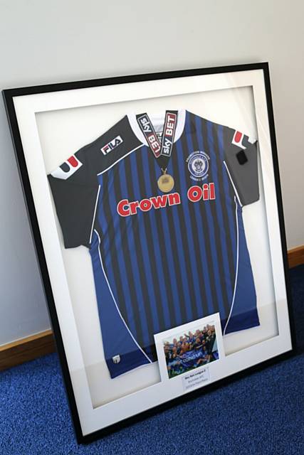 Signed Rochdale shirt and medal