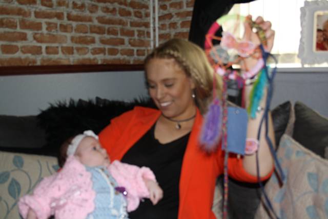 Chloe Whitehead with her dreamcatcher and daughter, Esme