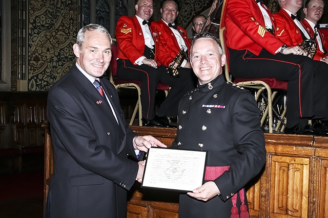 King’s Division Band concert at Rochdale Town Hall<br />Col (Ret'd) Philip Naylor OBE presents an award to Captain Justin Matthews