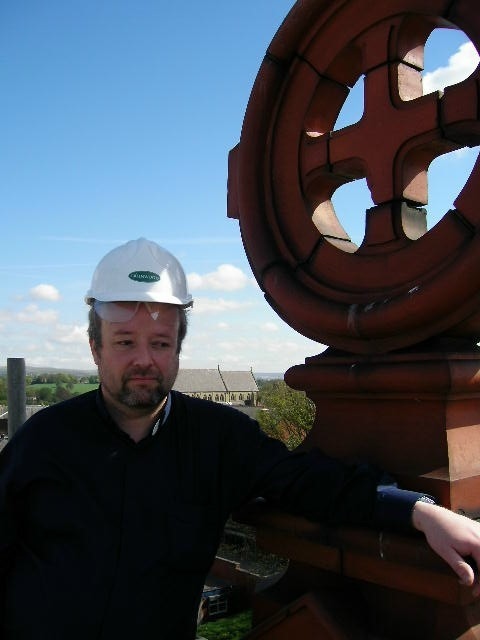 Fr Paul Daly on the roof of St. Joseph's