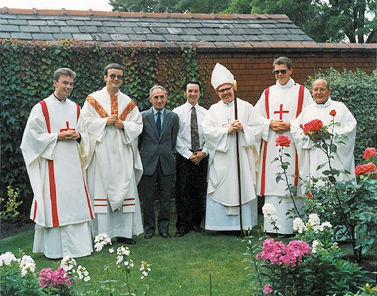 Fr Daly with Bishop Kelly, his father and brother and assisting clergy