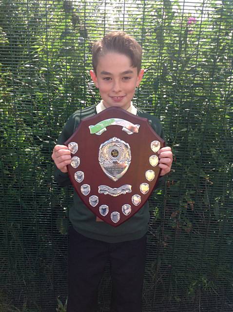 Jacob Simpson receives the first ‘The Tony MacSparran Award' at Woodland Community Primary School