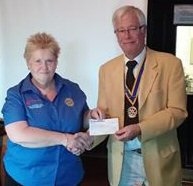 Club President Len Albon presenting the donation to Pam Joyce of Disaster Aid UK & Ireland 