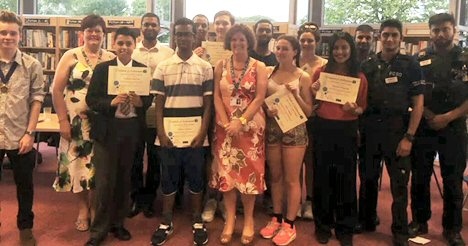 Gail Hopper with the young people she presented with first aid certificates for completing a first aid course in youth service sessions