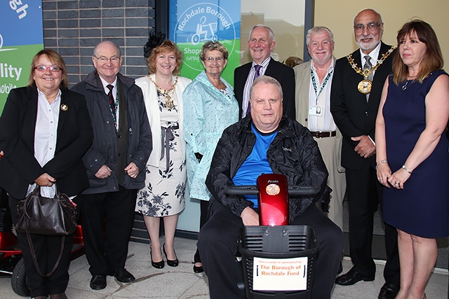 Councillor Kathleen Nickson, Councillor Billy Sheerin, Mayoress Cecile Biant, Councillor Jean Hornby, Councillor Ashley Dearnley, Councillor Allen Brett, Mayor Surinder Biant, Manager Michelle Hollinrake and Carl Moxon at the opening of the new Shopmobility premises