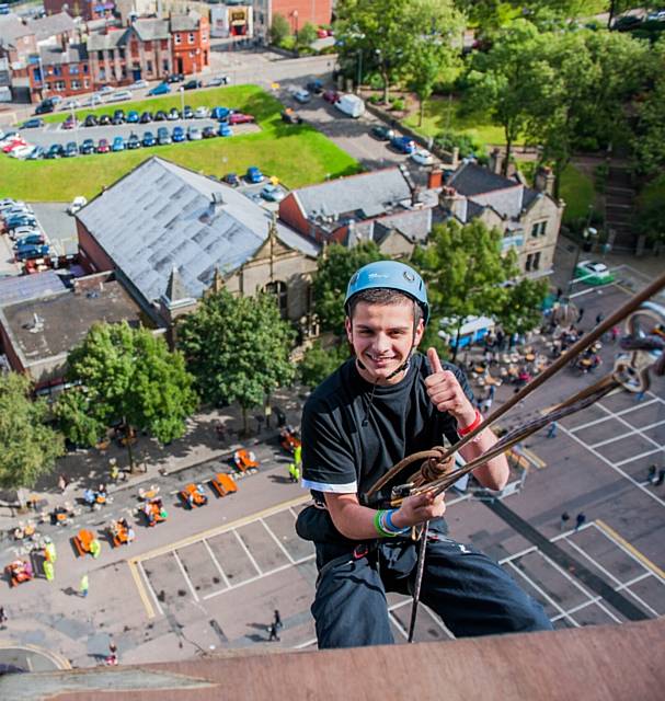 Leon Hollinrake begins his abseil last year. Rochdale Town Hall hosts another charity abseil and guided tours