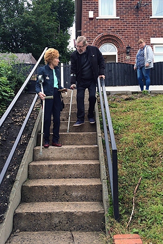 Elderly residents attempting to use the steep steps on Major Street, Milnrow