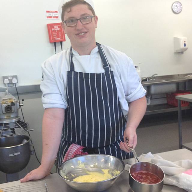 Damien Thompson demonstrating how to make strawberry jam and sponges