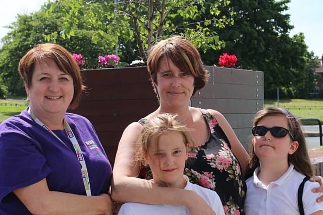 RBH tenant and Q Gardens volunteer, Jill Hughes, with her twin daughters Sally and Alex (age 10) and RBH Neighbourhood Housing Officer, Davina Unsworth