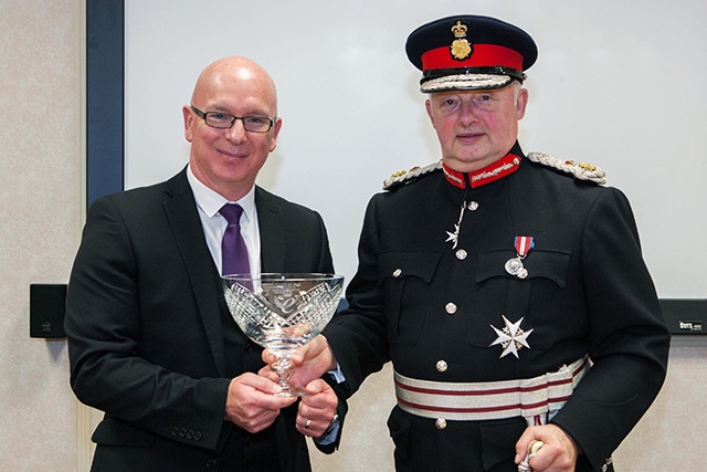 Holroyd Precision Chief Executive Officer, Dr Tony Bannan, receives the Queen’s Award for Enterprise from Warren J Smith Esq. JP, HM Lord-Lieutenant of Greater Manchester