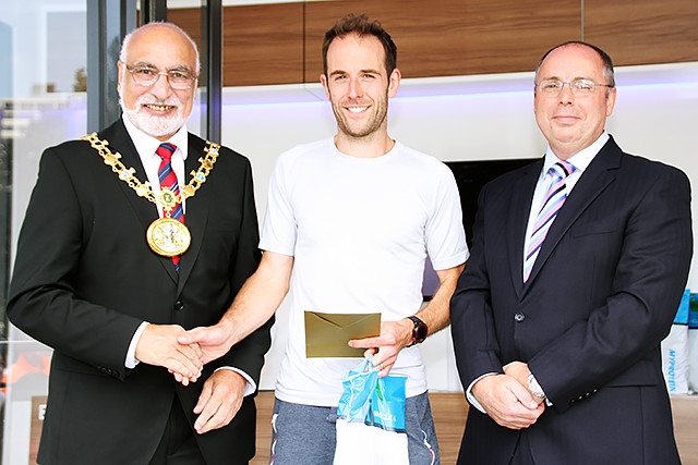 Rochdale Half Marathon winner Dave Archer collects his prize