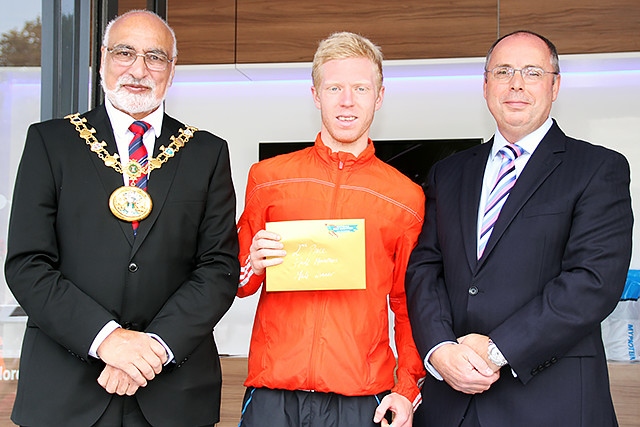 Second place in the Rochdale Half Marathon Nathan Kilcourse collects his prize