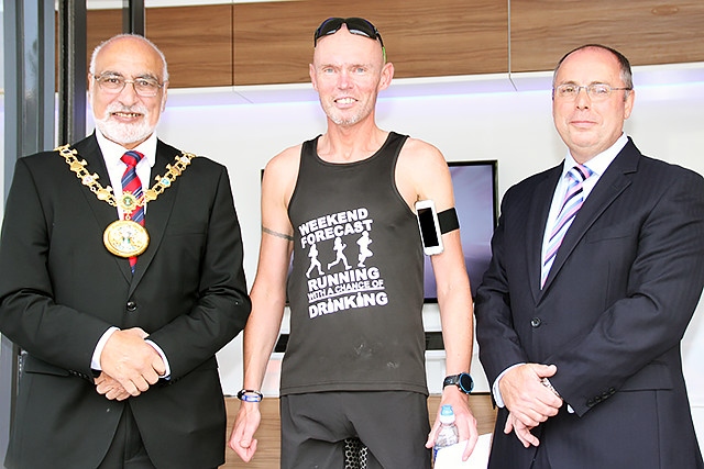 Rochdale Half Marathon male team winners Royton Roadrunners collect their prize