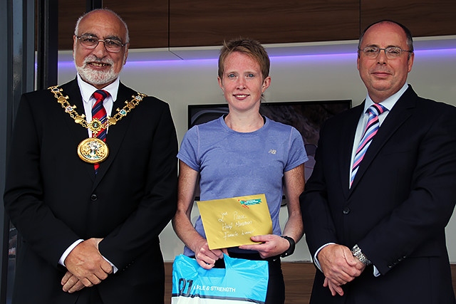 Rochdale Half Marathon second place female runner Jenny Knass collects her prize