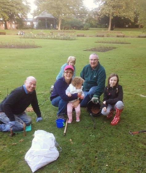 Middleton Rotary Club and family members in Jubilee Park, Middleton planting crocus bulbs