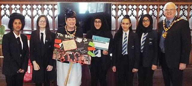 Kingsway Park students with the Mayor and Mayoress of Rochdale, with the placard to commemorate the 100-year anniversary of the Battle of the Somme