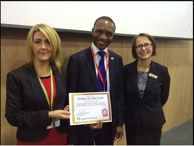 Wardle Academy, EAL coordinator, Ms Tetlow and Director of the City of Sanctuary, Charles Kwaku-Odoi and Mrs Fisher, Headteacher