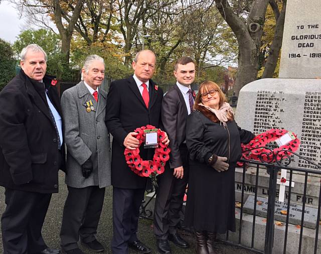 Tributes being laid at the Balderstone War Memorial