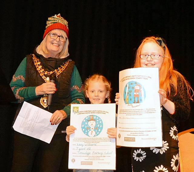 Mayor of Whitworth, Madeline De Souza with the winners of the school’s badge design competition, seven-year old Lucy Williams from Tonacliffe Primary and 10-year old Hazel Murphy Wisker from St Bartholomew’s Primary