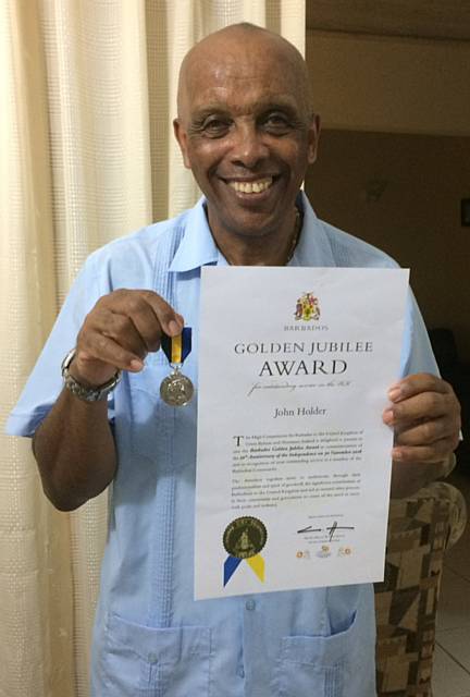 John Holder receives Barbados Golden Jubilee medal