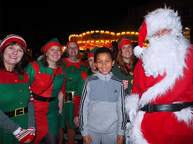 Cayden Blake at the Littleborough Christmas lights switch on with Father Christmas and his elves