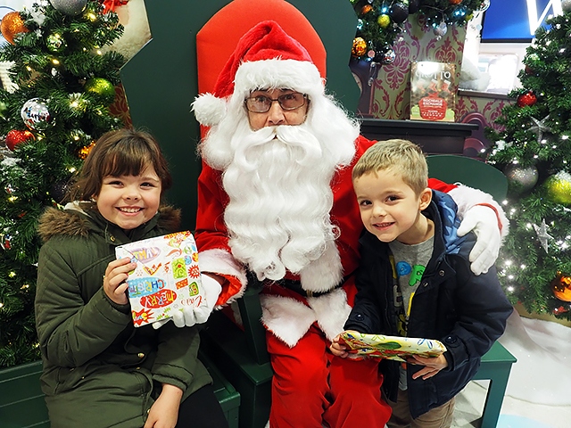 Children meet Santa in the Rochdale Exchange Shopping Centre Grotto