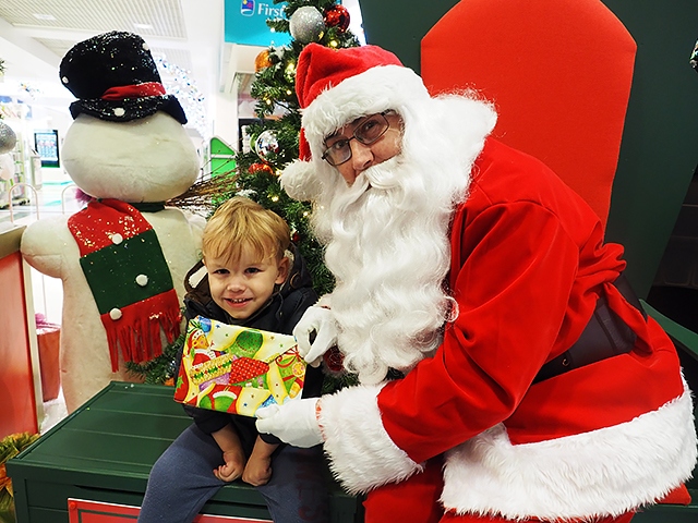 Children meet Santa in the Rochdale Exchange Shopping Centre Grotto